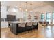 Bright kitchen features quartz counters, a central island with seating, and stainless steel appliances at 1653 Pamela Ne Dr, Brookhaven, GA 30319