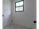 Simple laundry room with tile flooring and white walls at 1653 Pamela Ne Dr, Brookhaven, GA 30319