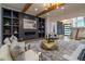 Open-concept living room with high ceilings, built-ins and sleek modern stair case at 1653 Pamela Ne Dr, Brookhaven, GA 30319