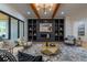 Cozy living room showcasing custom built-ins, and seamless access to the outdoor living space at 1653 Pamela Ne Dr, Brookhaven, GA 30319
