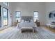 Spacious main bedroom with high ceilings, large windows, and stylish decor at 1653 Pamela Ne Dr, Brookhaven, GA 30319