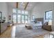 Luxurious main bedroom featuring vaulted ceiling, exposed beams, and many windows at 1653 Pamela Ne Dr, Brookhaven, GA 30319