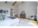 Open and airy main bedroom with elegant decor, wood floors, and natural light at 1653 Pamela Ne Dr, Brookhaven, GA 30319