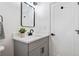 Bathroom with gray vanity, white countertop, black hardware, and door at 3048 San Jose Dr, Decatur, GA 30032