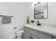 Bathroom with gray vanity, white countertop, black hardware, and tiled shower at 3048 San Jose Dr, Decatur, GA 30032