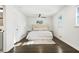 Serene bedroom with a plush bed, neutral tones, hardwood floors, and ample natural light at 3048 San Jose Dr, Decatur, GA 30032