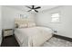 Well appointed bedroom features hardwood floors, side table and plush queen bed at 3048 San Jose Dr, Decatur, GA 30032