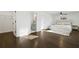 Bright bedroom features hardwood floors, a modern ceiling fan, and an attached bathroom at 3048 San Jose Dr, Decatur, GA 30032