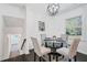 Cozy dining area with modern lighting and a view of the well-lit lower level at 3048 San Jose Dr, Decatur, GA 30032