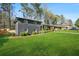 Attractive gray brick home with a spacious yard and manicured shrubbery at 3048 San Jose Dr, Decatur, GA 30032