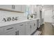 Modern kitchen with white subway tile, gray cabinets, and sleek black hardware at 3048 San Jose Dr, Decatur, GA 30032