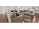 Open-concept living room with hardwood floors, leading into a dining area and modern kitchen at 3048 San Jose Dr, Decatur, GA 30032