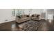 Spacious living room features hardwood floors, modern sofas, and access to a staircase at 3048 San Jose Dr, Decatur, GA 30032