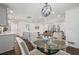 Bright, open living space featuring hardwood floors, modern lighting, and a large window at 3048 San Jose Dr, Decatur, GA 30032