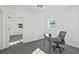 This bright office includes a window, neutral carpet and desk with room to spread out at 3048 San Jose Dr, Decatur, GA 30032