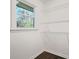 Well-lit walk-in closet with wire shelving and a window for natural light at 3048 San Jose Dr, Decatur, GA 30032