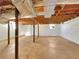 Spacious unfinished basement with exposed beams, concrete flooring, and natural light at 3686 Sweetbriar Cir, Lithia Springs, GA 30122