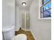 Clean bathroom with a tiled shower, toilet, and natural light at 3686 Sweetbriar Cir, Lithia Springs, GA 30122