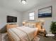 Comfortable bedroom with a cozy bed, a TV, and modern decor, creating a relaxing and inviting space at 3686 Sweetbriar Cir, Lithia Springs, GA 30122
