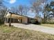 Home with a large carport and additional parking, set in a landscaped yard at 3686 Sweetbriar Cir, Lithia Springs, GA 30122