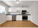 Well-lit kitchen featuring modern stainless steel appliances, clean white cabinets, and durable countertops at 3686 Sweetbriar Cir, Lithia Springs, GA 30122
