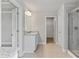 Bathroom featuring double vanity, walk-in shower and tile floors at 3856 Lockaby Way, Lawrenceville, GA 30044