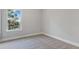 Bedroom featuring a window, carpeted floors, and neutral wall color, offering a blank canvas for personalization at 3856 Lockaby Way, Lawrenceville, GA 30044