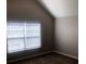 Bedroom with a window offering natural light, comfortable carpeting at 6645 Oak Hill Pass, Fairburn, GA 30213