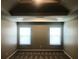 Bedroom featuring recessed ceilings, two windows, and natural light at 6645 Oak Hill Pass, Fairburn, GA 30213