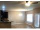 Open living space includes a dining area, kitchen bar, and outdoor access at 6645 Oak Hill Pass, Fairburn, GA 30213
