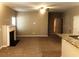 Living room with a decorative fireplace, ceiling fan, and granite countertops at 6645 Oak Hill Pass, Fairburn, GA 30213