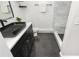 Bright bathroom featuring a vessel sink, modern fixtures, and a tiled shower with a built-in bench at 1661 La France Ne St # 314, Atlanta, GA 30307