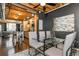Open-concept dining area with a glass table, seating for four, and stainless steel kitchen nearby at 1661 La France Ne St # 314, Atlanta, GA 30307