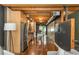 Living area with stainless appliances, open design, and polished concrete floors at 1661 La France Ne St # 314, Atlanta, GA 30307