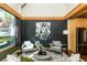 Stylish living area with large windows, accent walls, and modern seating arrangements and polished concrete floors at 1661 La France Ne St # 314, Atlanta, GA 30307