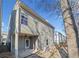 View of the back porch, including a ceiling fan, swings, and a view of the yard at 218 Hickory Commons Way, Canton, GA 30115