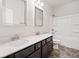 Clean bathroom with dual sink vanity, tile floor, and shower/tub combo at 218 Hickory Commons Way, Canton, GA 30115