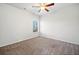 A bedroom with neutral walls and carpet, window, and ceiling fan at 218 Hickory Commons Way, Canton, GA 30115