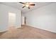 Bright bedroom with neutral walls, carpet, closet and doorway at 218 Hickory Commons Way, Canton, GA 30115