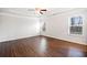 Large primary bedroom with tray ceilings, ceiling fan, and natural light at 218 Hickory Commons Way, Canton, GA 30115