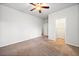 Bright bedroom with neutral walls, carpet, ceiling fan, closet, and doorway at 218 Hickory Commons Way, Canton, GA 30115