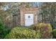 Stone community sign for Hickory Commons Established 2016 surrounded by manicured bushes at 218 Hickory Commons Way, Canton, GA 30115