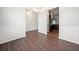 Open dining room with wood flooring and access to kitchen with stainless steel appliances at 218 Hickory Commons Way, Canton, GA 30115