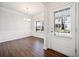 Dining room featuring wood flooring, modern chandelier, and large bright windows at 218 Hickory Commons Way, Canton, GA 30115