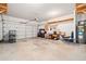 Spacious garage with overhead door, storage shelves and water heater at 218 Hickory Commons Way, Canton, GA 30115