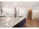 Open concept kitchen featuring a large island with granite countertops at 218 Hickory Commons Way, Canton, GA 30115