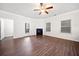 Spacious living room with a fireplace, hardwood floors, and natural light at 218 Hickory Commons Way, Canton, GA 30115