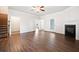 Open living room with fireplace, hardwood floors, and neutral color palette at 218 Hickory Commons Way, Canton, GA 30115