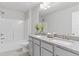 Light and bright bathroom features a double sink vanity, tub and shower at 3786 Lockaby Way, Lawrenceville, GA 30044