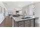 Bright kitchen features stainless appliances, a large island and overlooks the great room at 3786 Lockaby Way, Lawrenceville, GA 30044